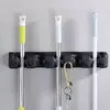 Suport de perete tip organizator pentru maturi si mop, 6 cuiere pliabile, Negru